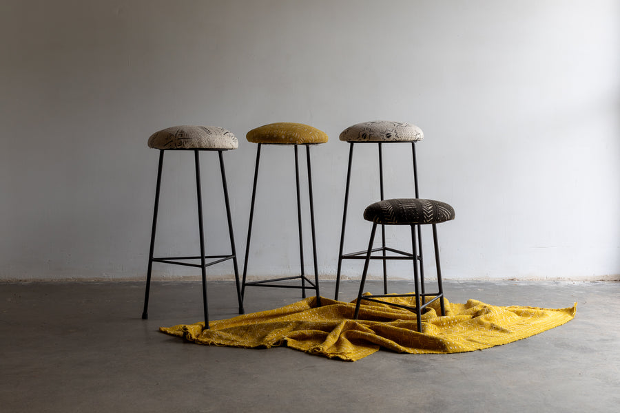 Low bogolan upholstered stool